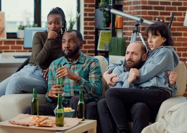 freepik - Diverse friends being scared watching horror movie