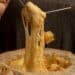 pexels-gonzalo-acuna-fromages fondant et coulant dans une fondue-Pourquoi faire une fondue savoyarde au kot